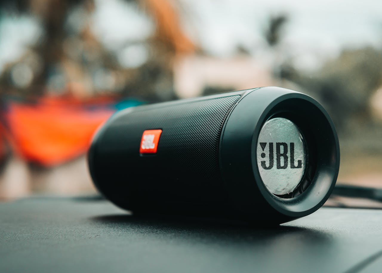 category-05 Focused shot of a black JBL portable speaker on a surface, ideal for technology concepts.